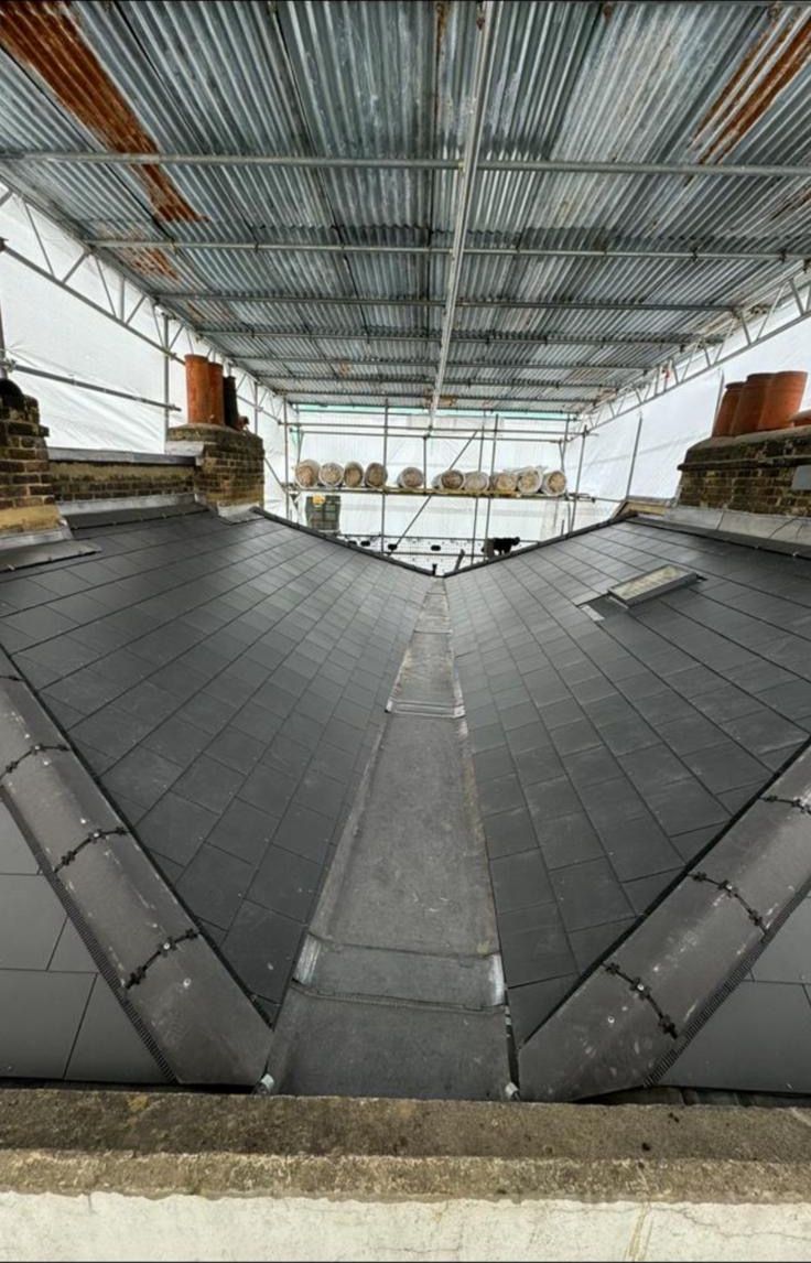 Natural slate re-roof with a lead-lined central valley