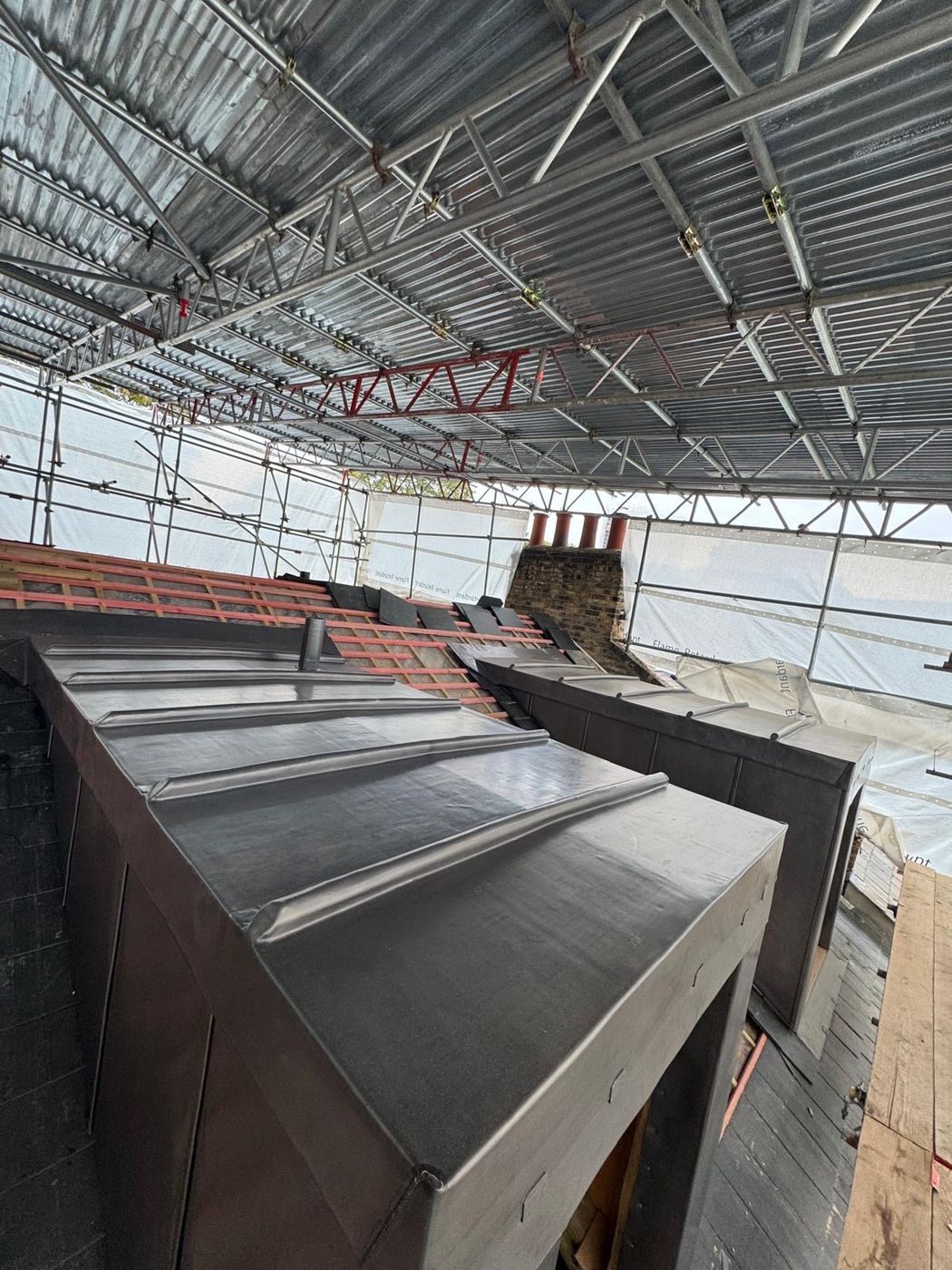 Lead dormer roofs dressed with traditional rolls